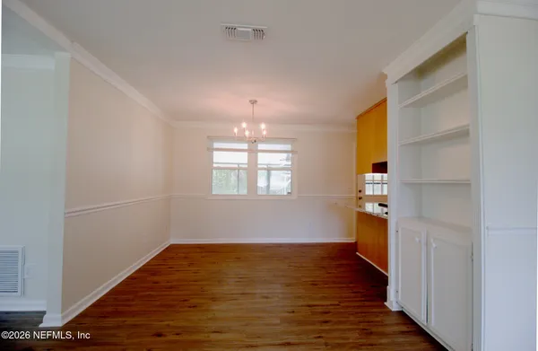 a view of livingroom with hardwood floor and hallway