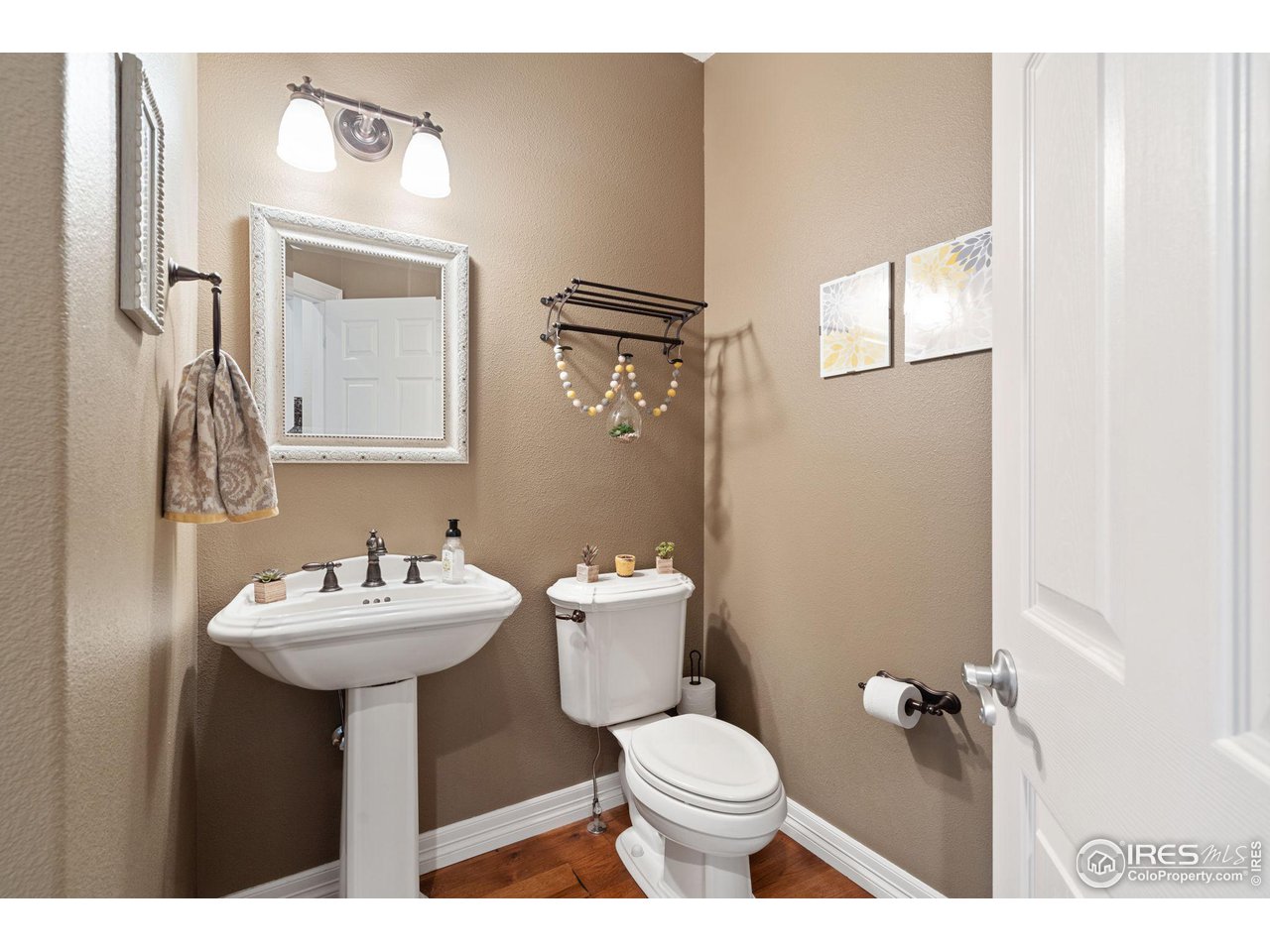 6523 Aberdour Circle Windsor, CO 80550 - Photo 14 of 40 a bathroom with a sink mirror and toilet