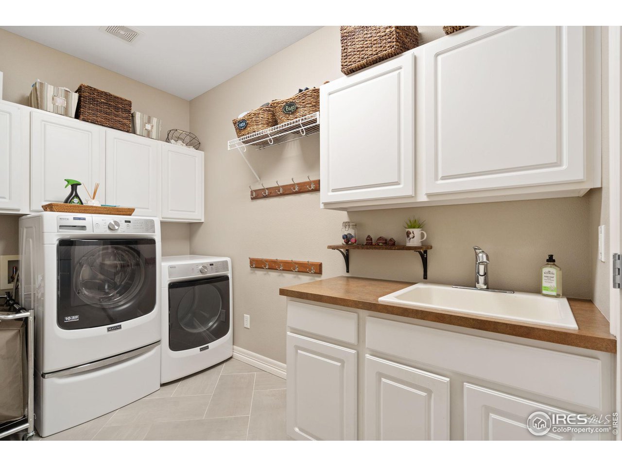6523 Aberdour Circle Windsor, CO 80550 - Photo 15 of 40 a kitchen with stainless steel appliances granite countertop a sink and a stove