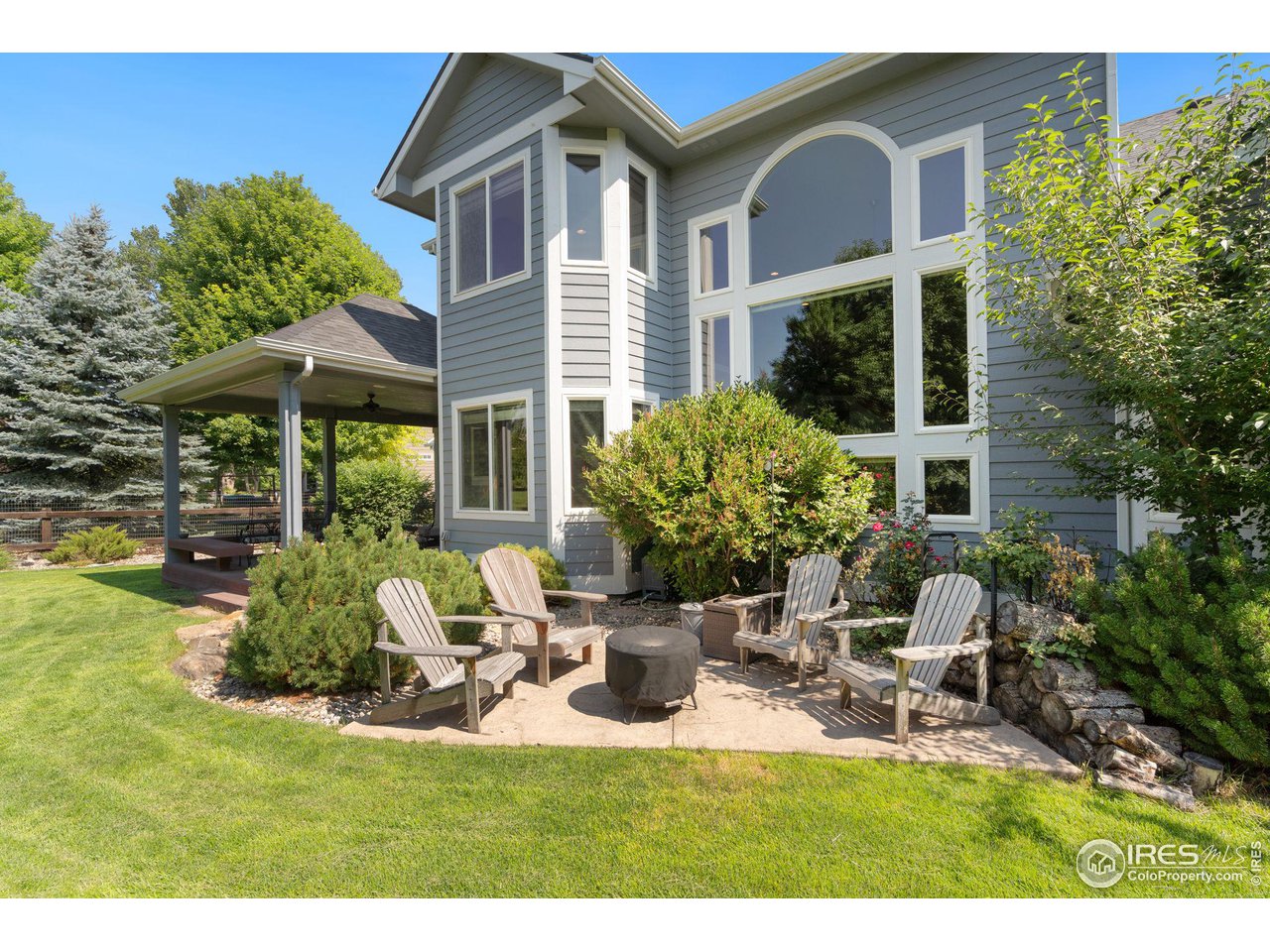 6523 Aberdour Circle Windsor, CO 80550 - Photo 34 of 40 a view of a house with backyard sitting area and garden