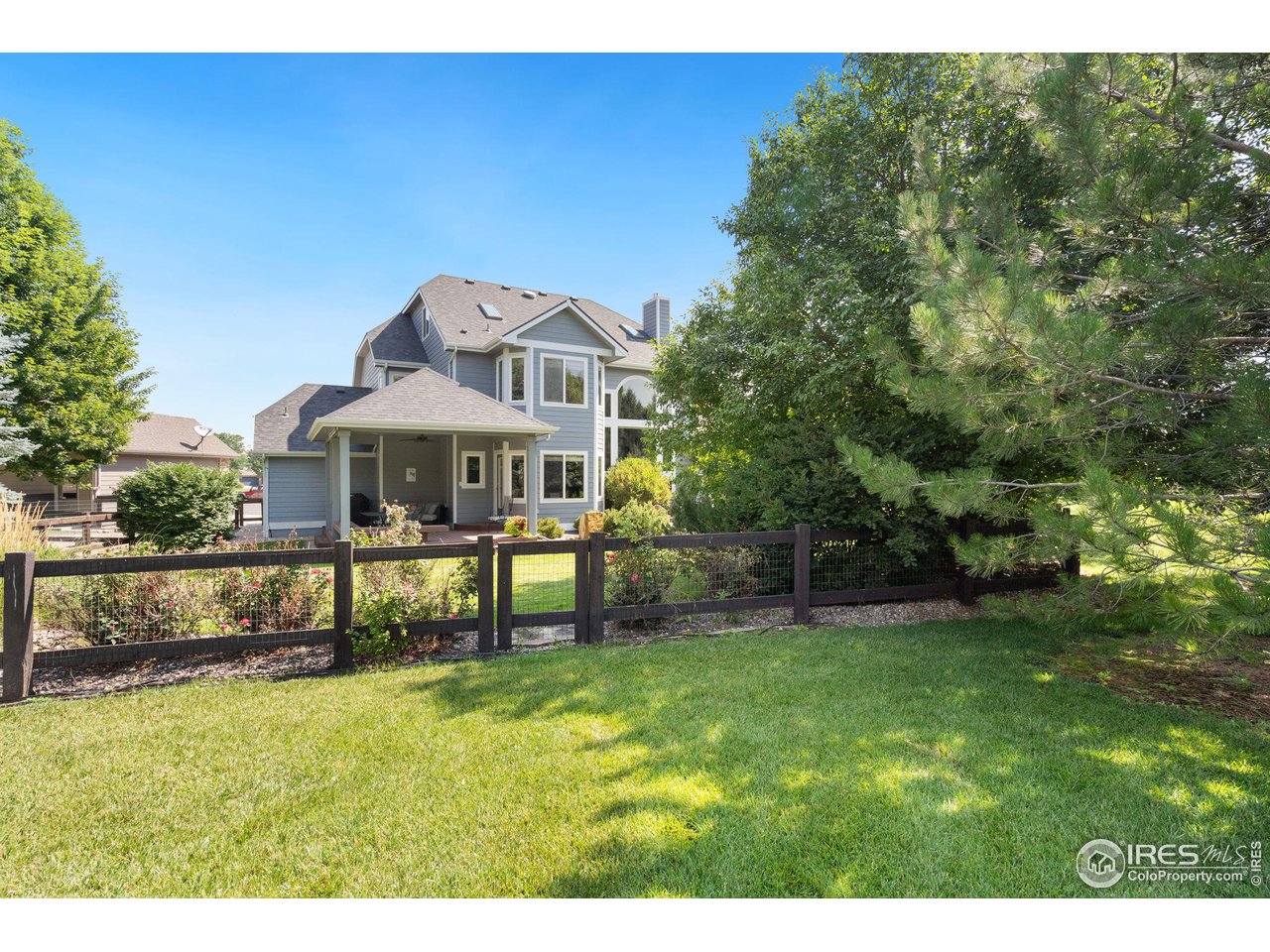 6523 Aberdour Circle Windsor, CO 80550 - Photo 37 of 40 a front view of a house with a yard