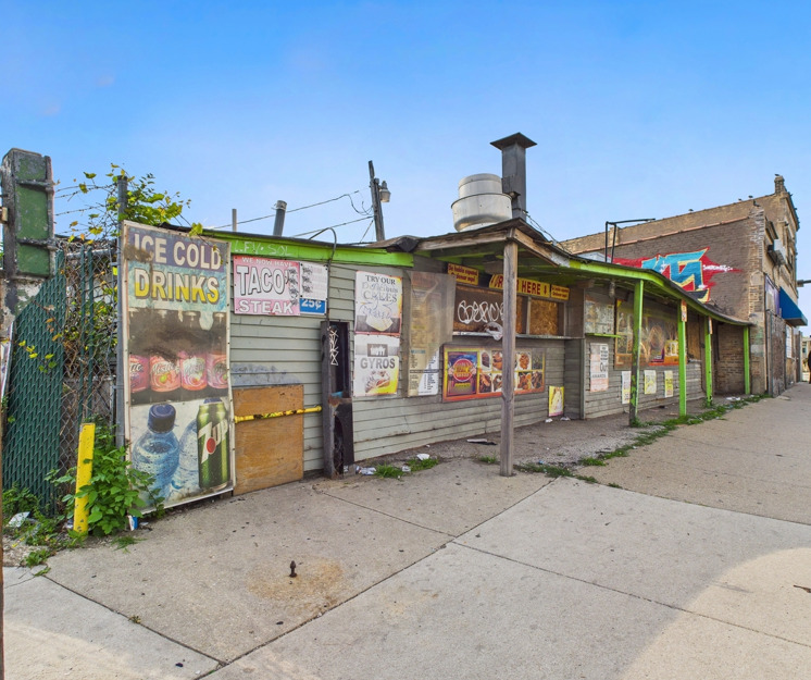 600-606 South Pulaski Road Chicago, IL 60624 - Photo 15 of 18 a front view of a house with garden