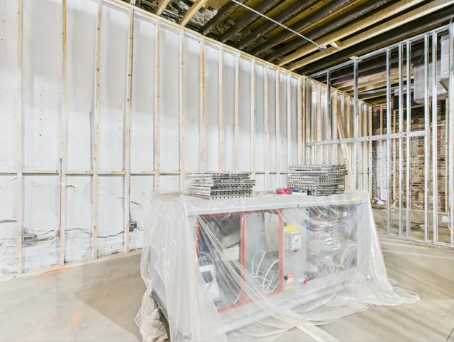 a view of a kitchen with a sink and cabinets