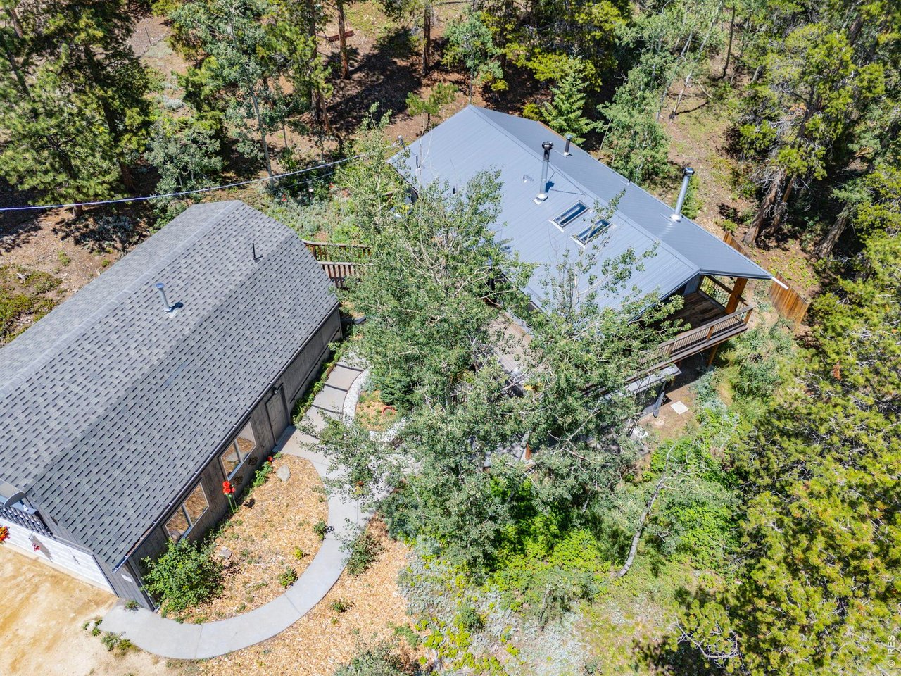 415 Upper Travis Gulch Road Black Hawk, CO 80422 - Photo 7 of 50 Main house has a newer steel roof (2023) w/ a 45 year transferable warranty