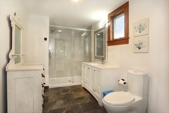 11 Sunset Drive Newbury, MA 01951 - Photo 13 of 16 a bathroom with a granite countertop sink a mirror and a toilet