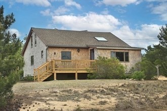 11 Sunset Drive Newbury, MA 01951 - Photo 4 of 16 a front view of a house with a yard and garage