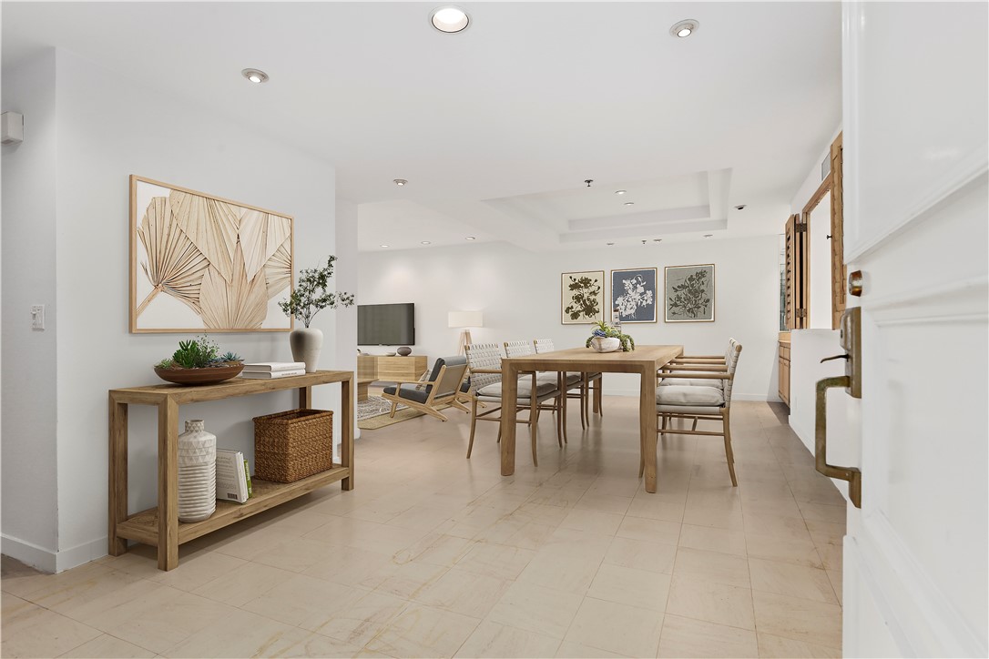 2122 Century Park Lane, Unit 108 Los Angeles, CA 90067 - Photo 1 of 1 a view of a livingroom with furniture and a dining table