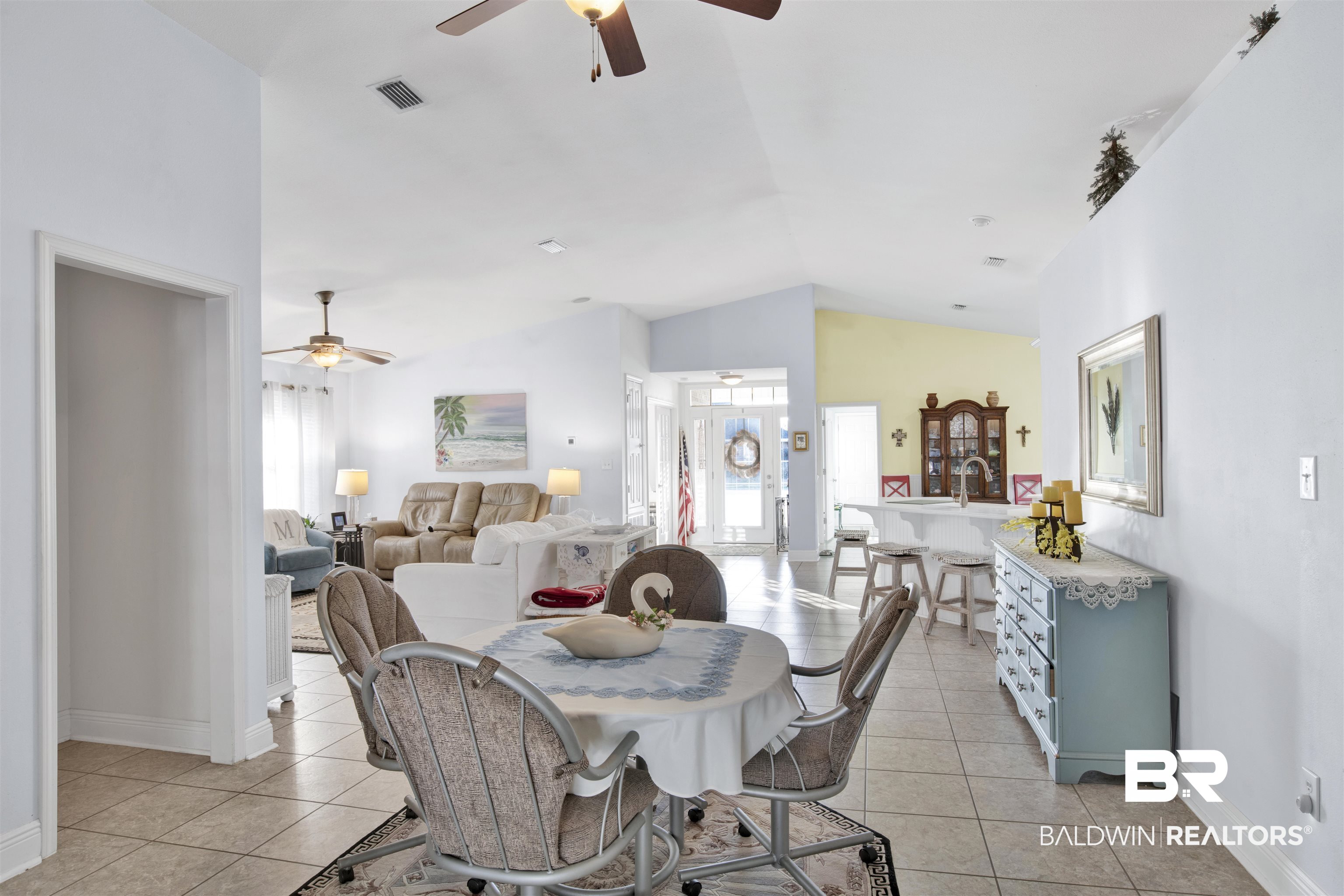 314 Blackfriars Street Fairhope, AL 36532 - Photo 9 of 25 Dining room with light tile patterned flooring, lofted ceiling, and ceiling fan