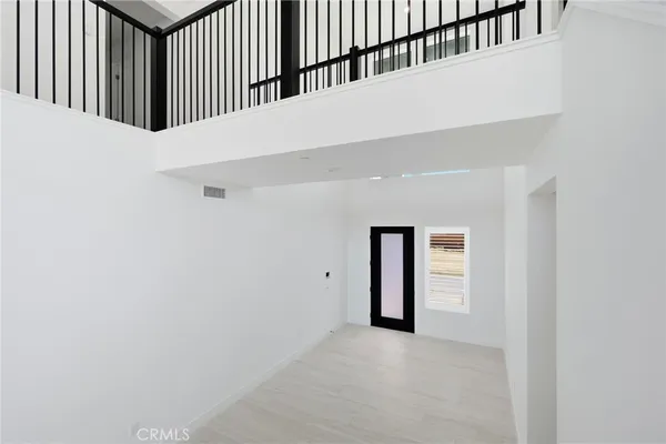 a kitchen with stainless steel appliances granite countertop a stove and a large window