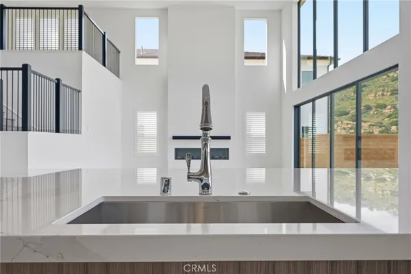 a kitchen with a sink and cabinets