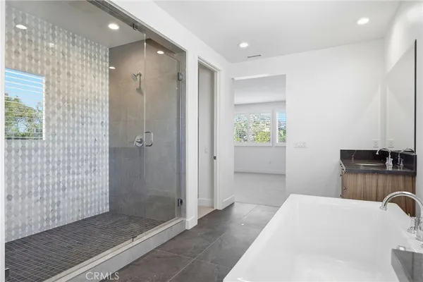 a bathroom with a sink a toilet and a bathtub