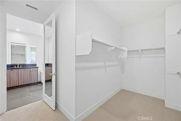 a view of storage and utility room with washer and dryer