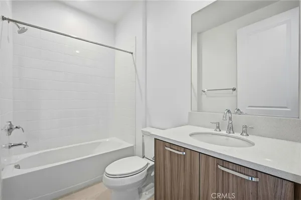 a view of an house with swimming pool and chairs