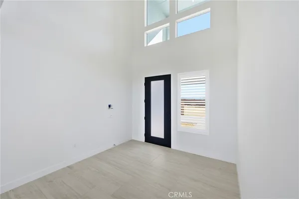 an empty room with a fireplace