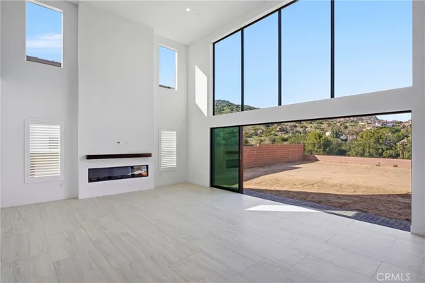 a view of a hallway with entryway and hall