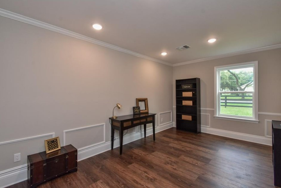 1506 10th Street Hempstead, TX 77445 - Photo 18 of 31 a view of a workspace with furniture and a window