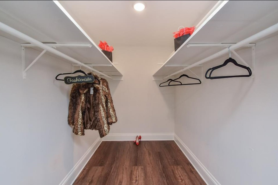 1506 10th Street Hempstead, TX 77445 - Photo 20 of 31 a view of walk in closet with clothes and shoes