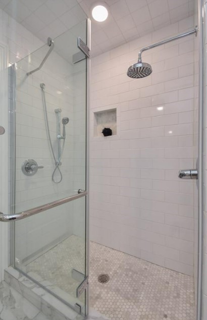 1506 10th Street Hempstead, TX 77445 - Photo 21 of 31 a bathroom with a glass shower door