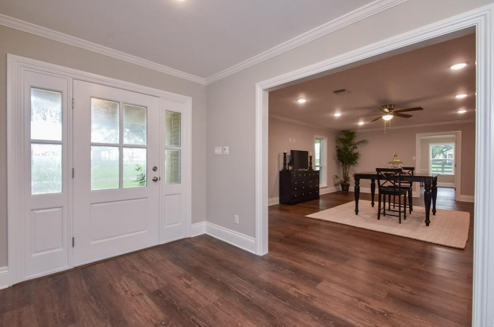 1506 10th Street Hempstead, TX 77445 - Photo 7 of 31 a view of a room with furniture and wooden floor