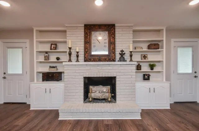 a living room with a fireplace and a flat screen tv