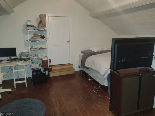 a bed room with a bed and a desk