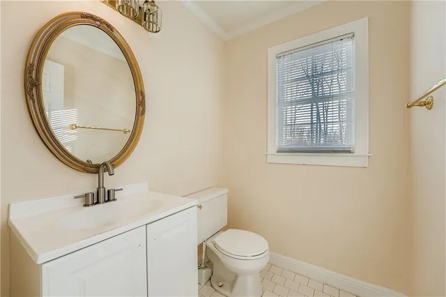 a bathroom with a sink a mirror and a toilet
