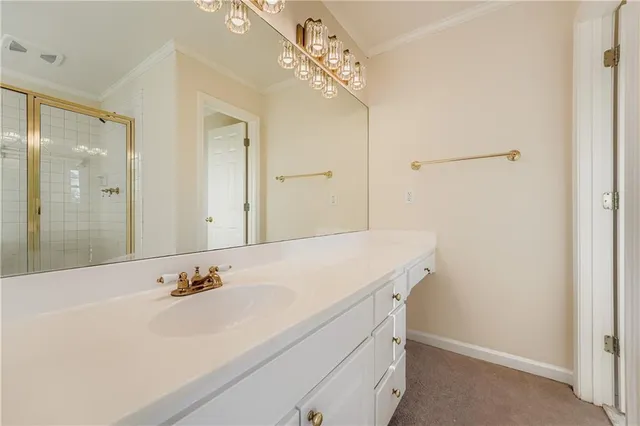 a bathroom with a sink vanity and a mirror