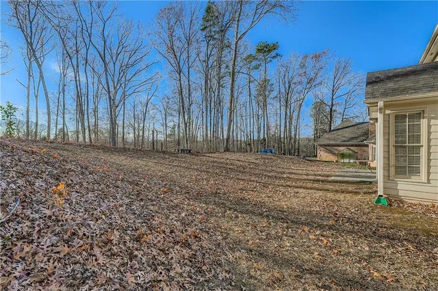 a view of a backyard of the house