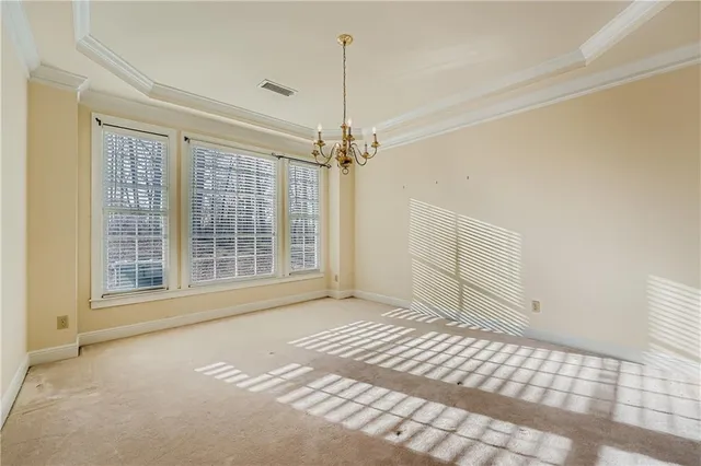 a view of a room with wooden floor and windows