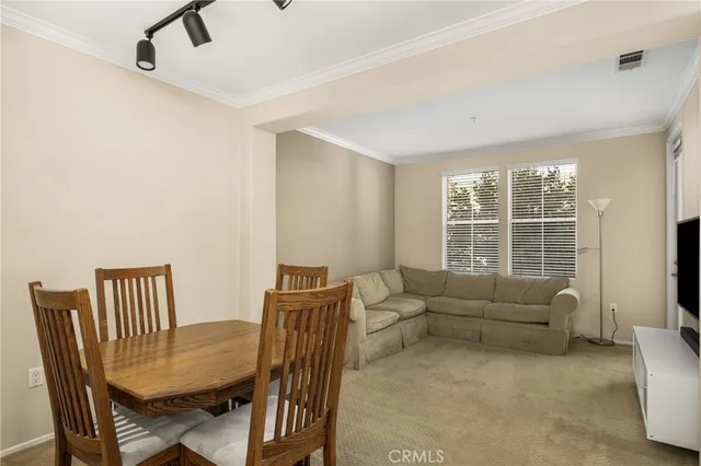 a view of a livingroom with furniture and a table