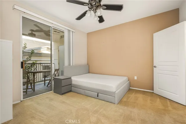 a room with a bed and a chandelier