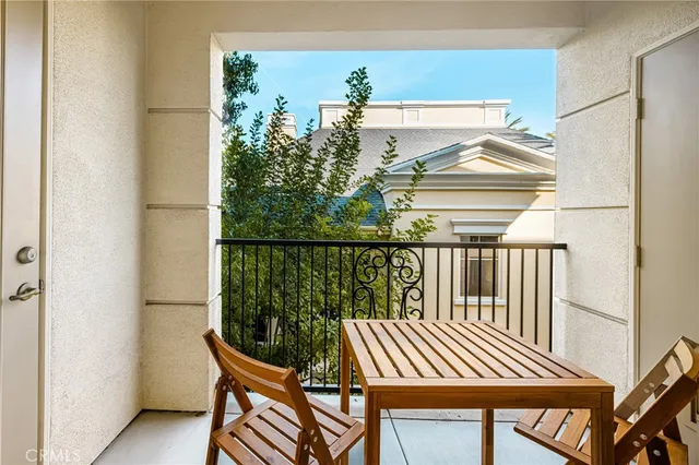 a view of balcony with wooden floor and outdoor seating