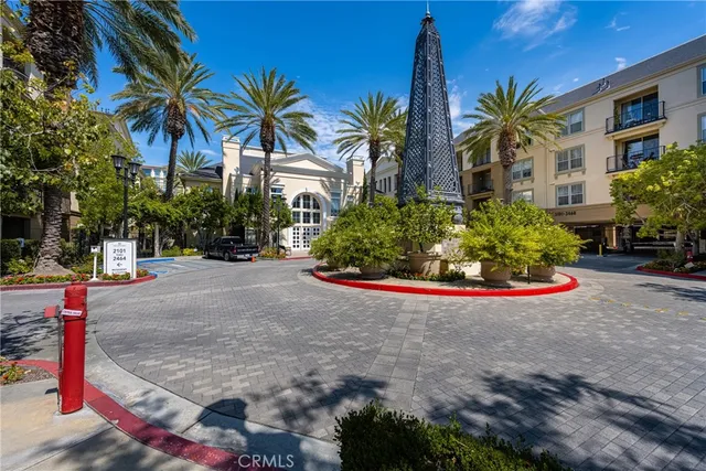 a front view of multiple houses with yard