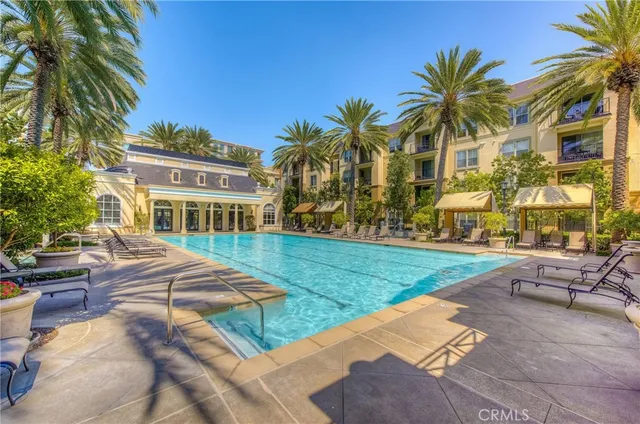 a view of a palm trees from a balcony
