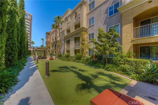 a building outdoor space with patio furniture and potted plants