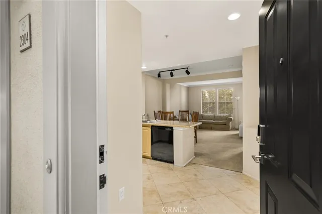 a kitchen with sink and cabinets