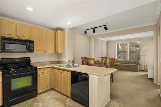 a kitchen with a stove sink and microwave