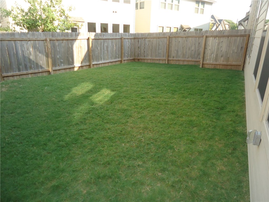 13001 Hymeadow Drive, Unit 36 Austin, TX 78729 - Photo 20 of 20 a view of a backyard with a garden