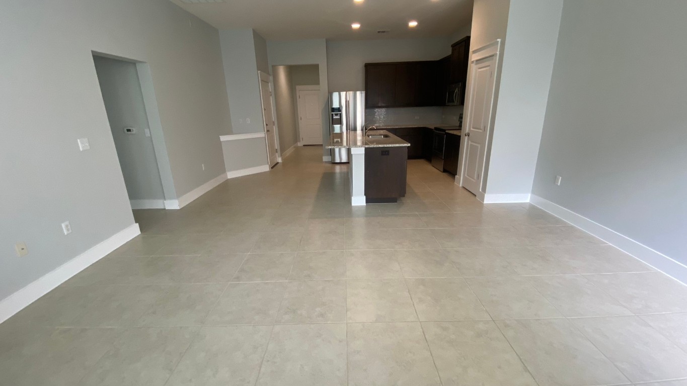 13001 Hymeadow Drive, Unit 36 Austin, TX 78729 - Photo 5 of 20 a view of kitchen with refrigerator and wooden floor