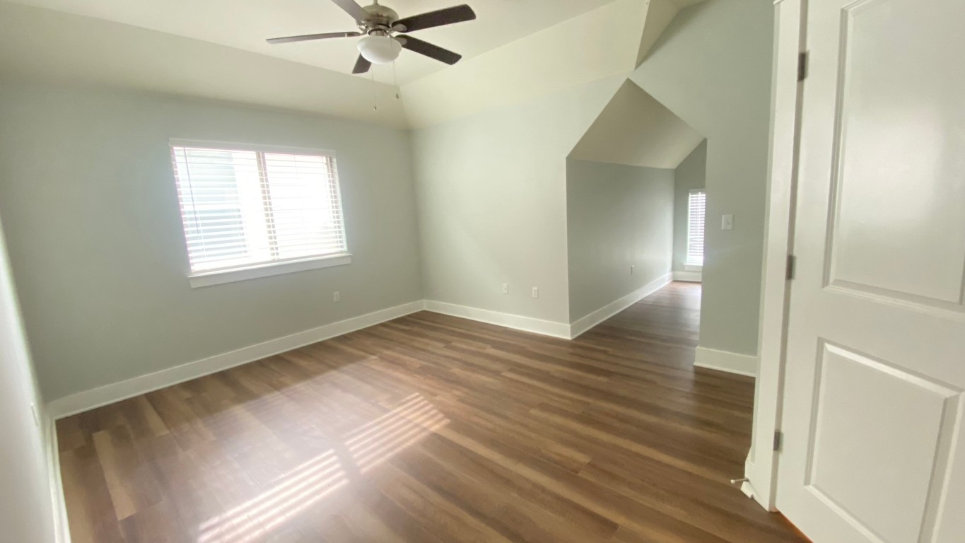 13001 Hymeadow Drive, Unit 36 Austin, TX 78729 - Photo 6 of 20 a view of a livingroom with wooden floor and a ceiling fan