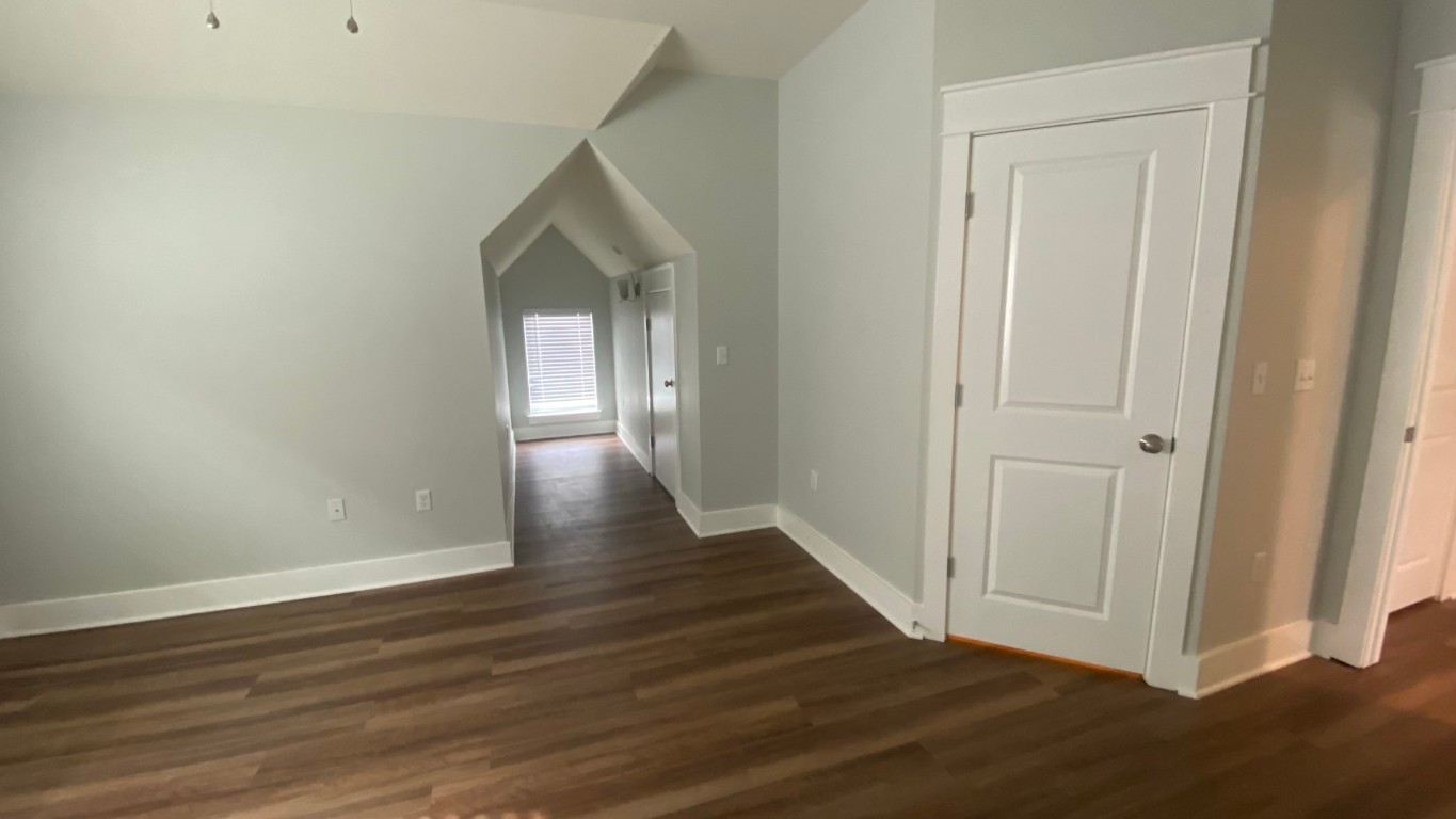 13001 Hymeadow Drive, Unit 36 Austin, TX 78729 - Photo 8 of 20 a view of a hallway with wooden floor