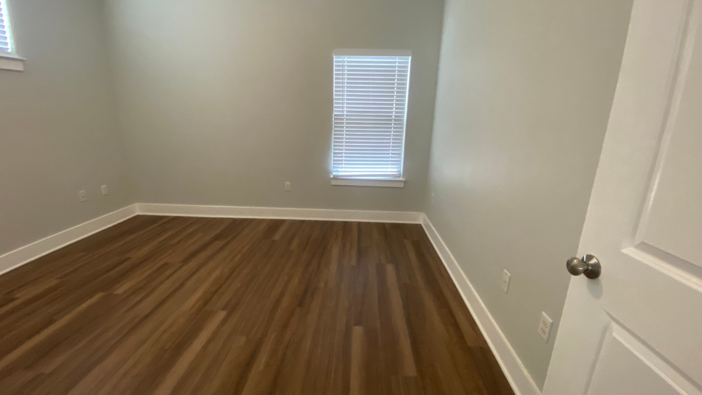 13001 Hymeadow Drive, Unit 36 Austin, TX 78729 - Photo 10 of 20 a view of a room with wooden floor and window