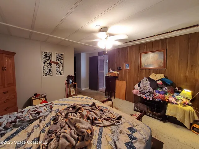 a bedroom with bed and a window