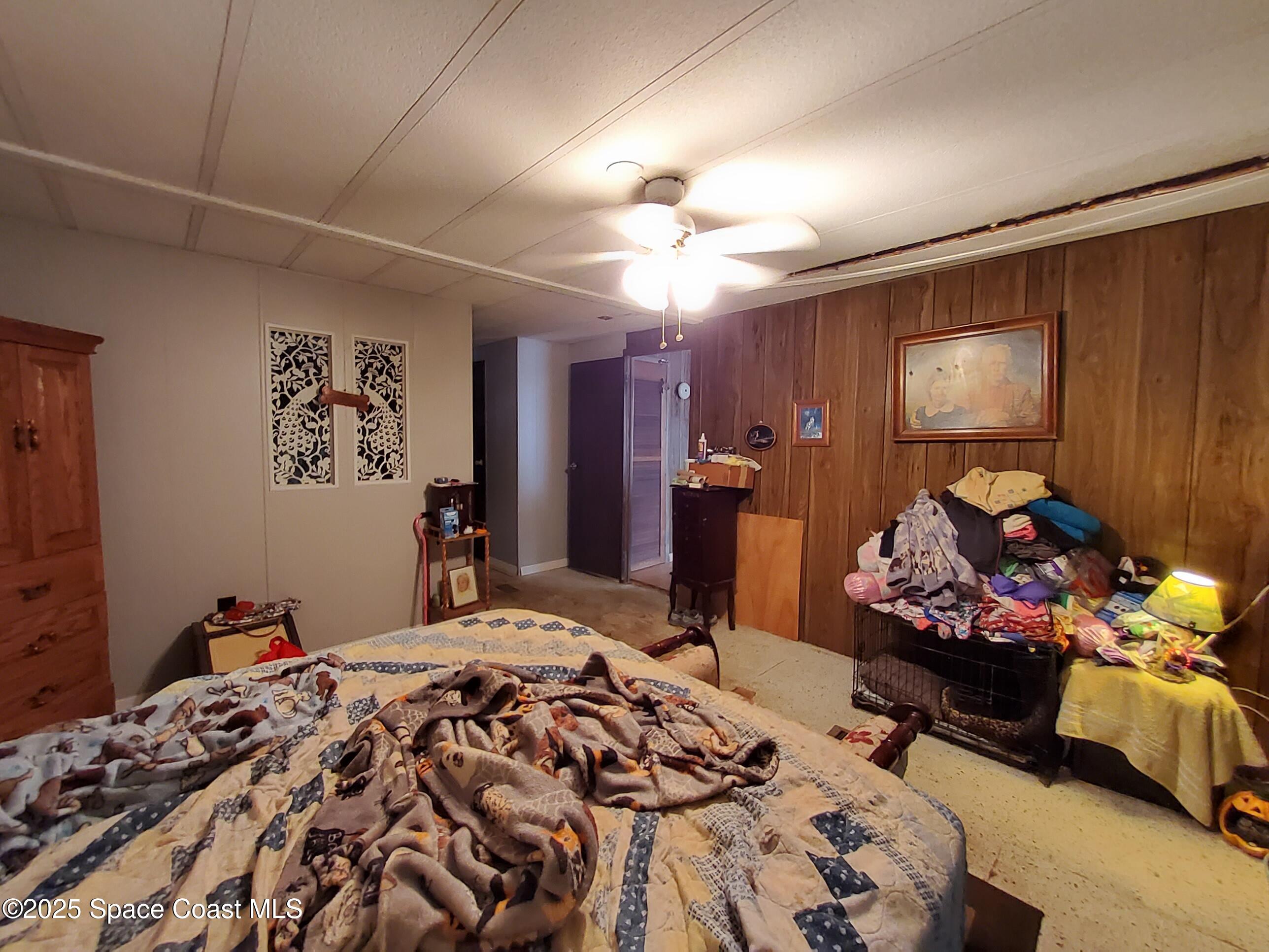 522 Clearview Drive Cocoa, FL 32927 - Photo 16 of 43 a bedroom with bed and a window