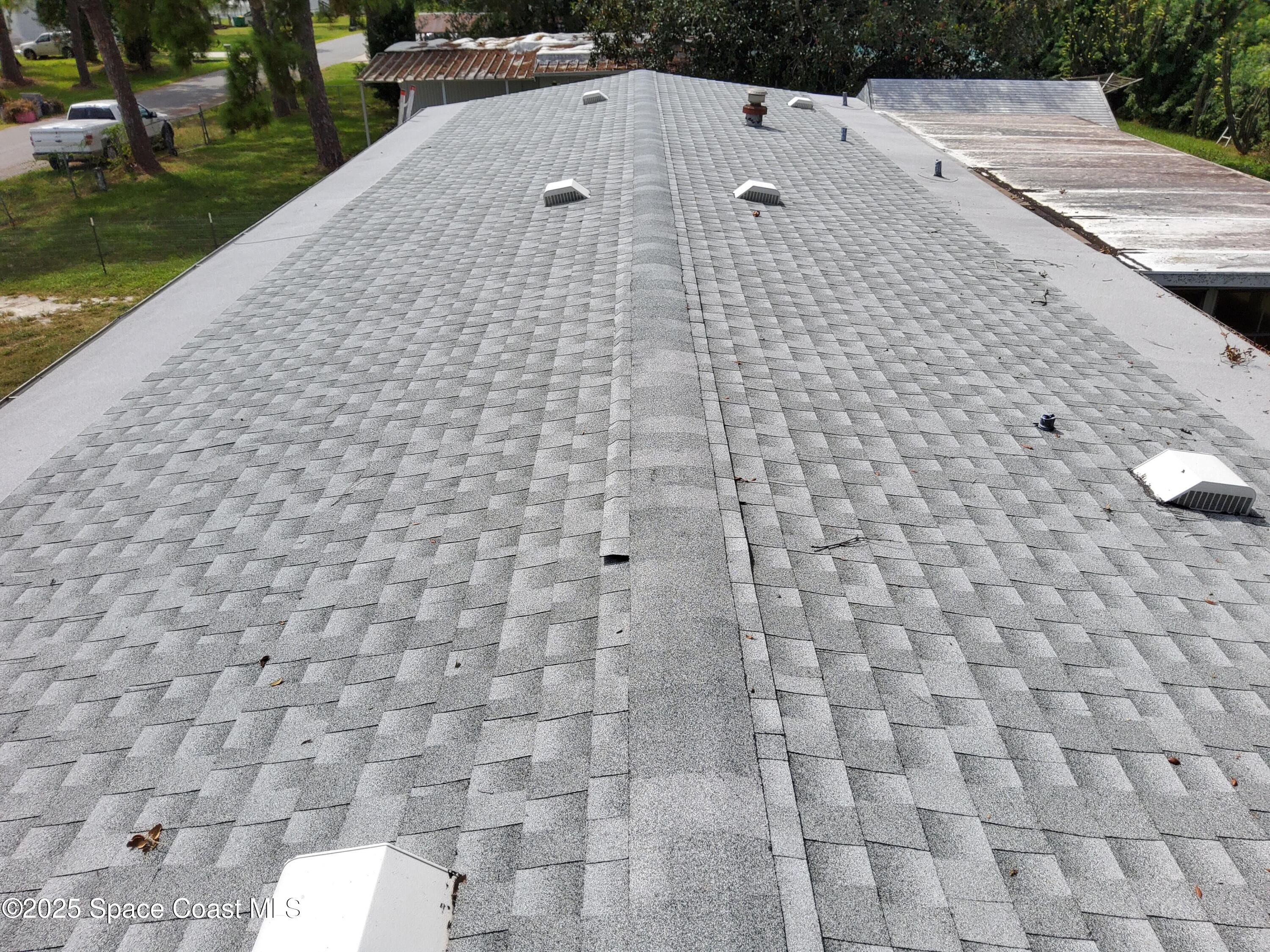 522 Clearview Drive Cocoa, FL 32927 - Photo 20 of 43 a terrace with a bench and trees around