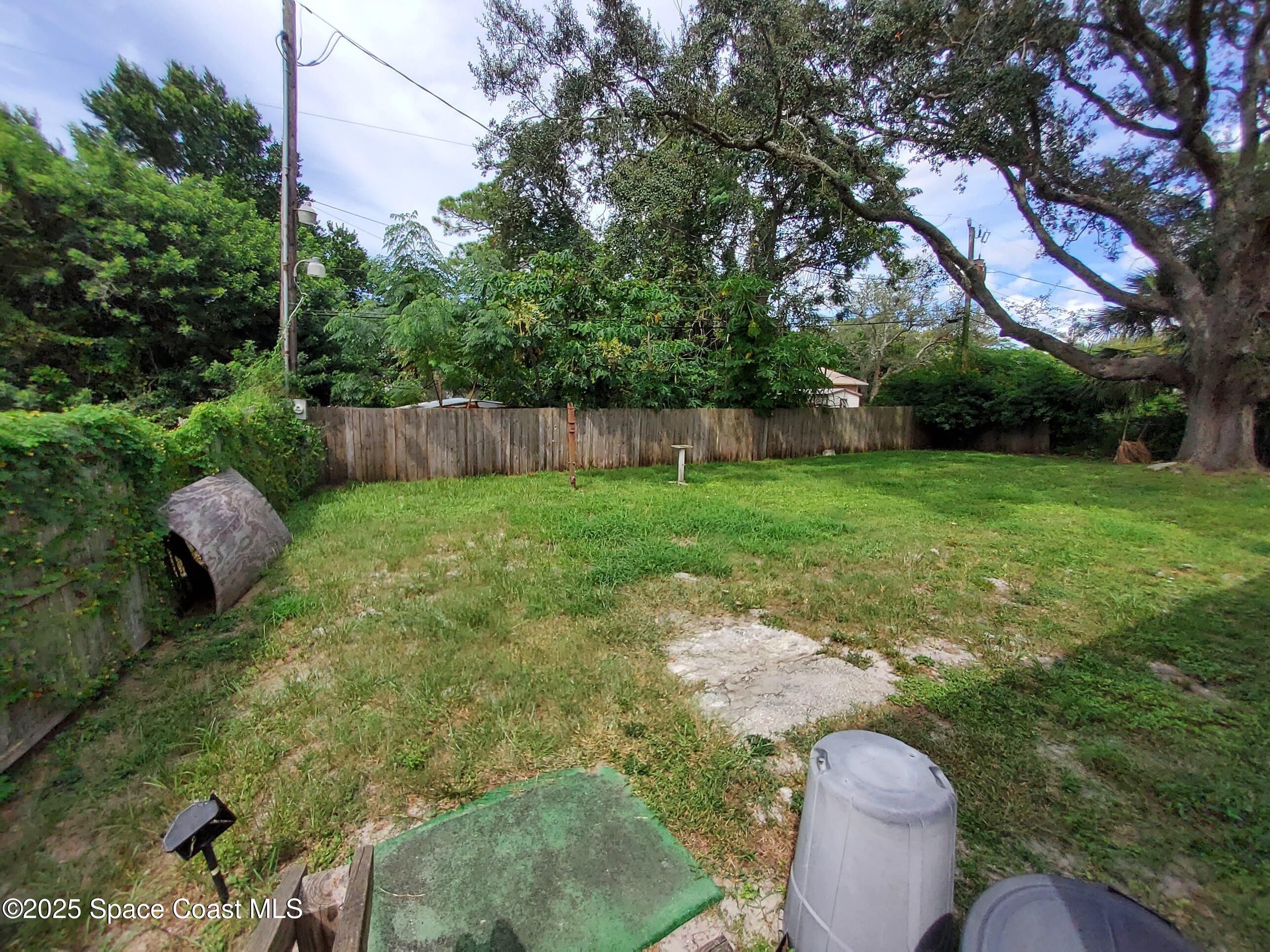 522 Clearview Drive Cocoa, FL 32927 - Photo 36 of 43 a backyard of a house with table and chairs