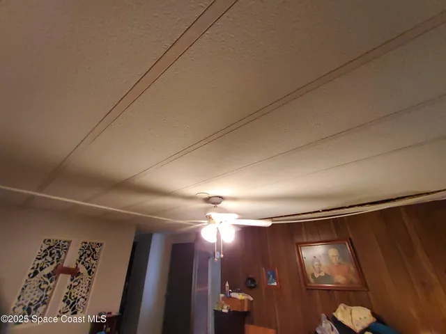 a kitchen with sink refrigerator and cabinets