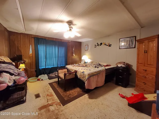 a bed room with a bed and a dresser