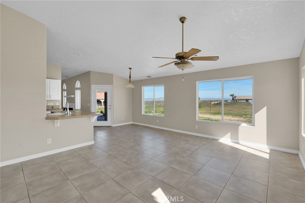 12865 Barbet Road Phelan, CA 92371 - Photo 16 of 51 a view of a kitchen with a sink and a window