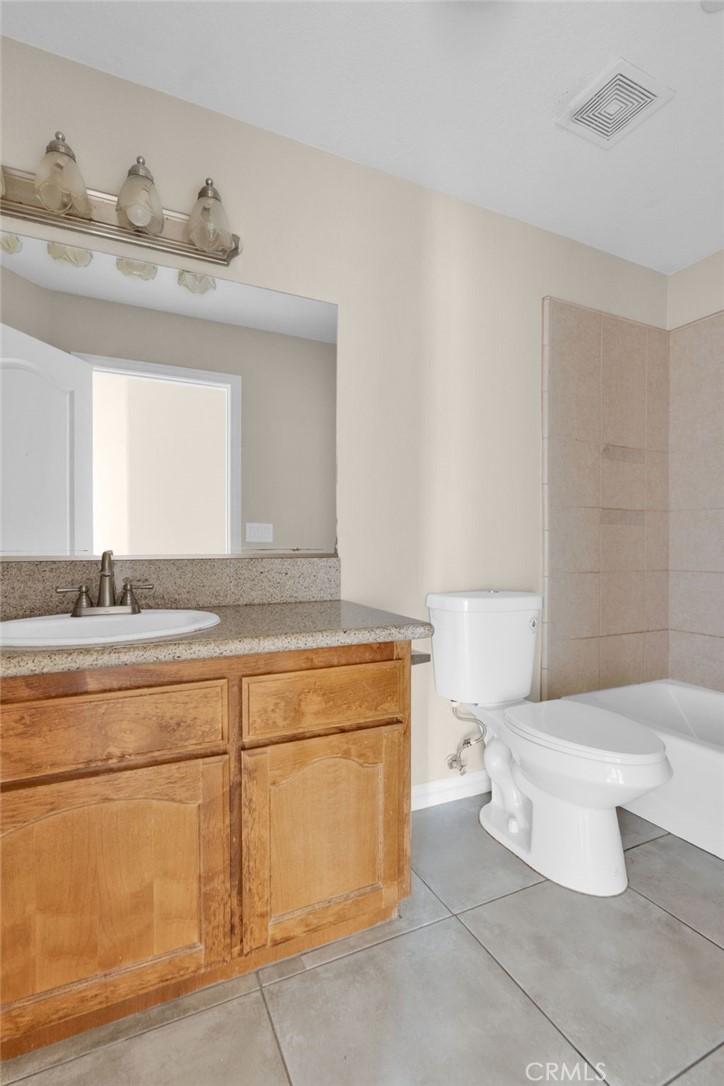 12865 Barbet Road Phelan, CA 92371 - Photo 23 of 51 a bathroom with a sink and a toilet